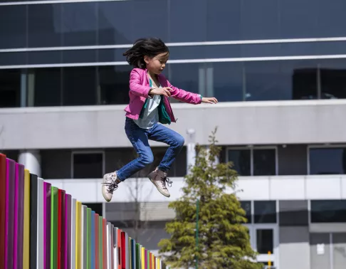 little girl jumping in the air