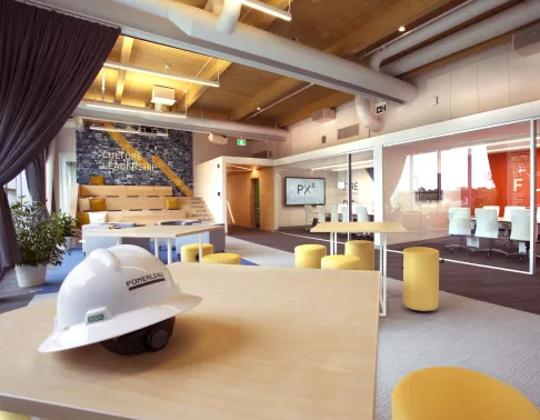 office space with construction hat in foreground