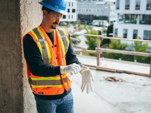 Man putting on gloves