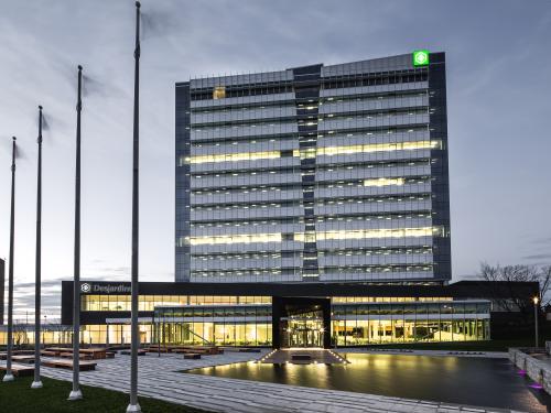 building with flag poles in foreground