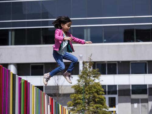little girl jumping in the air