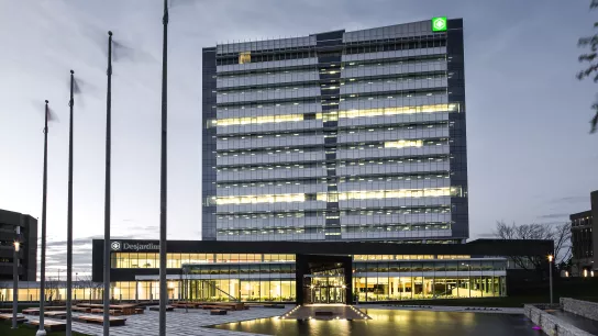 building with flag poles in foreground