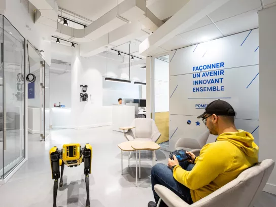 Man controlling robot dog