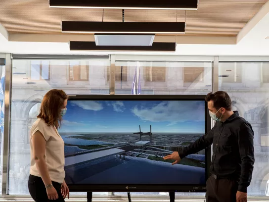 two people in a conference room