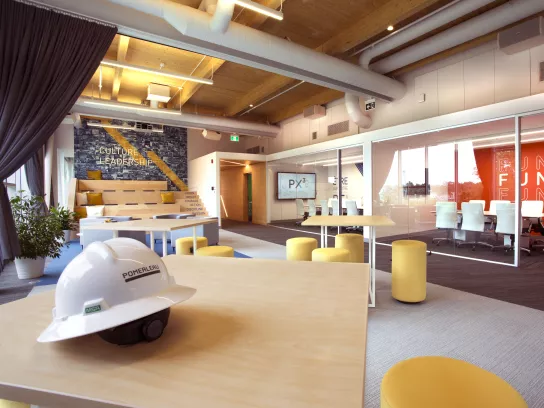 office space with construction hat in foreground