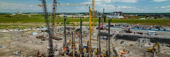 Pomerleau's heavy equipment on a construction site in Vaudreuil-Dorion, Quebec, an example of Pomerleau's uses of heavy equipment for deep foundations projects