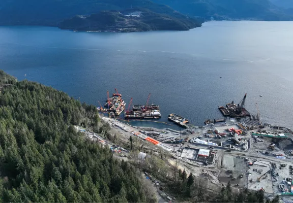 Construction of the Woodfibre LNG project by Pomerleau, a natural gas facility in British Columbia.