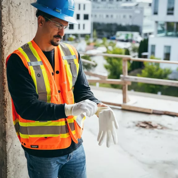 Man putting on gloves