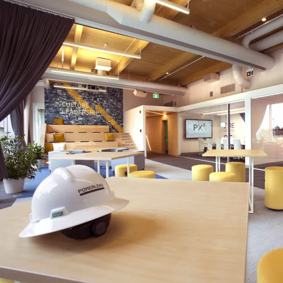 office space with construction hat in foreground