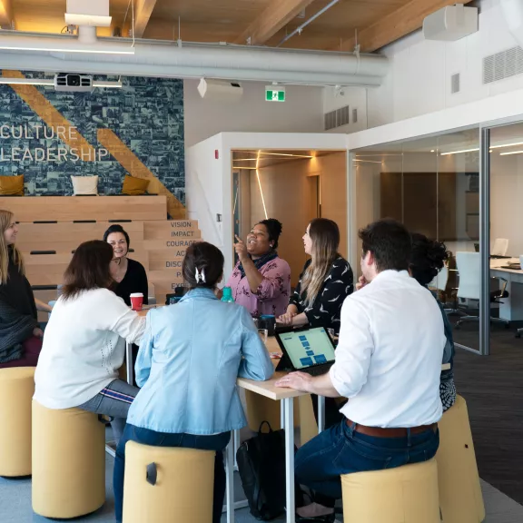 people around a table having a meeting
