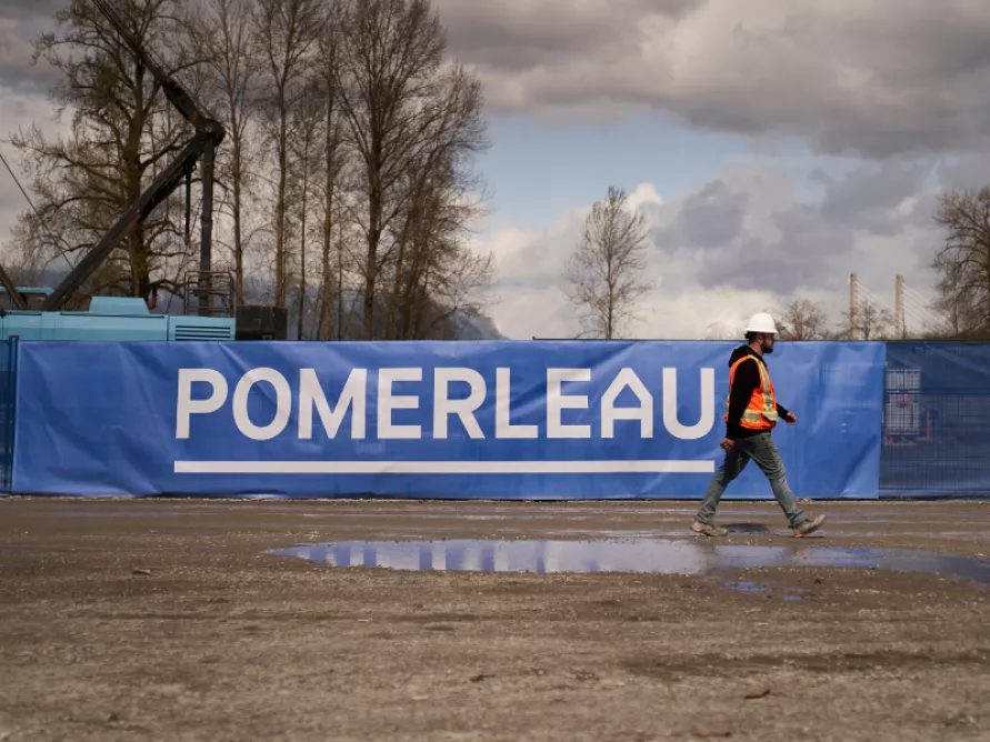 Pomerleau construction worker on a construction site in a rural area