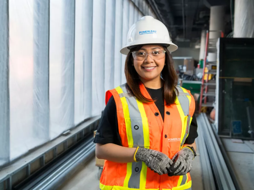 Worker from Pomerleau on the construction site of the University of Toronto New Student Residence in Scarborough, Ontario.