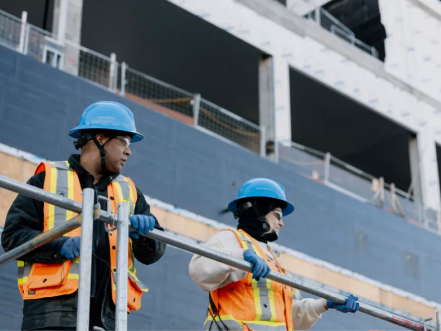 Workers from Pomerleau on a institutionnal construction site.