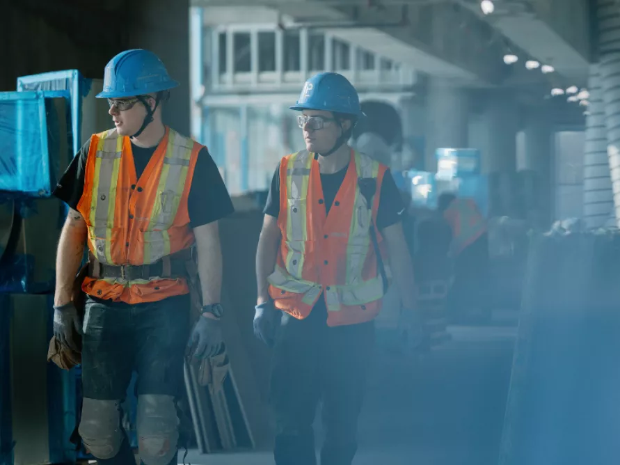 Pomerleau workers with their PPE equipment on a construction site