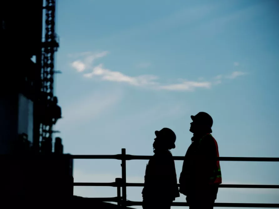 Workers from Pomerleau on a construction site.